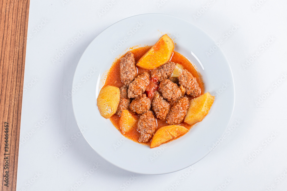 Turkish Traditional Soup with bread on white rustic wooden background, Izmir kofte yemegi. Turkish Traditional Soup with bread on white rustic wooden background, Izmir kofte yemegi.
