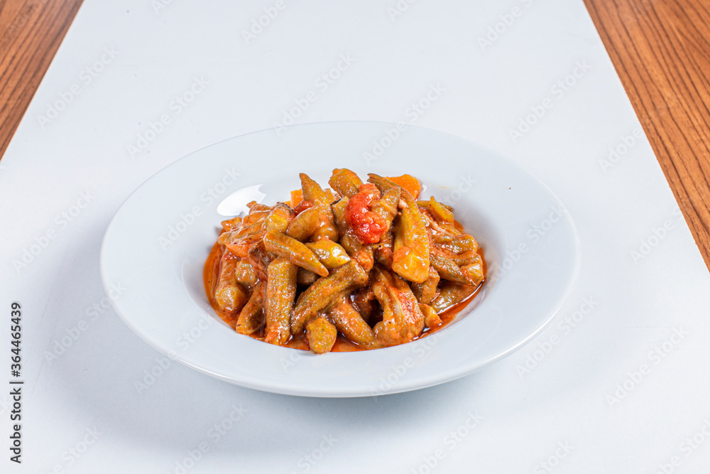 Turkish Traditional Soup with bread on white rustic wooden background, Bamya Yemeği. Turkish Traditional Soup with bread on white rustic wooden background, Bamya Yemeği.