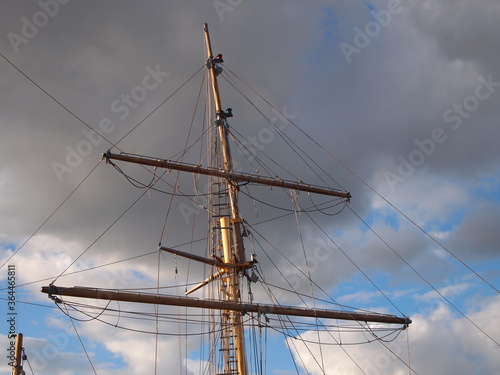 sail boat mast against stormy sky