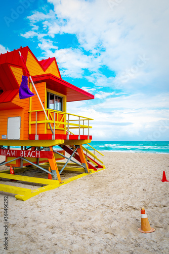 Wallpaper Mural Clouds over an orange, red and yellow lifeguard tower in South Beach Torontodigital.ca