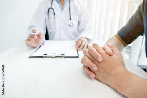 Female doctors who treat patients make an appointment to listen to the results after a physical examination and explain medical information and diagnose the disease. Medical concepts and good health