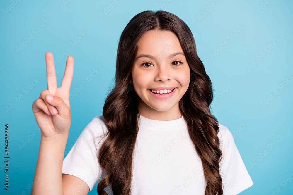 Close-up portrait of her she nice attractive lovely pretty cute cheerful cheery wavy-haired girl showing v-sign having fun isolated on bright vivid shine vibrant blue teal turquoise color background Close-up portrait of her she nice attractive lovely pretty cute cheerful cheery wavy-haired girl showing v-sign having fun isolated on bright vivid shine vibrant blue teal turquoise color background