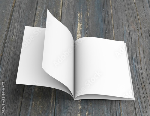 Open soft-cover book on a wooden table. 3D rendering.