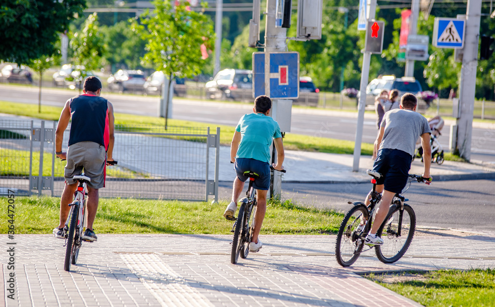 Cyclists ride on the bike path in the city Park
Cyclists ride on the bike path in the city Park