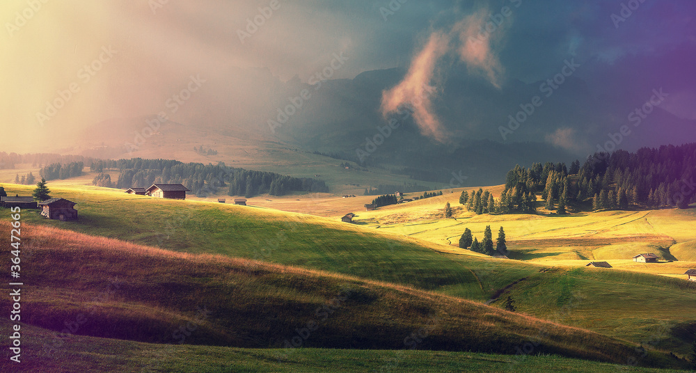Fototapeta Fantastic alpine valley Alpe di Susi early in the morning. Italya, Dolomites Alps, Europe. Colorful misty morning view. fairytale mountain valley under sunlit. Amazing Nature background.  Wild area