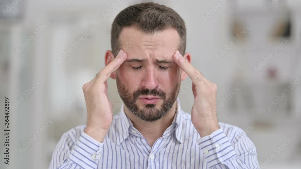 Portrait of Tired Young Man having Headache Portrait of Tired Young Man having Headache