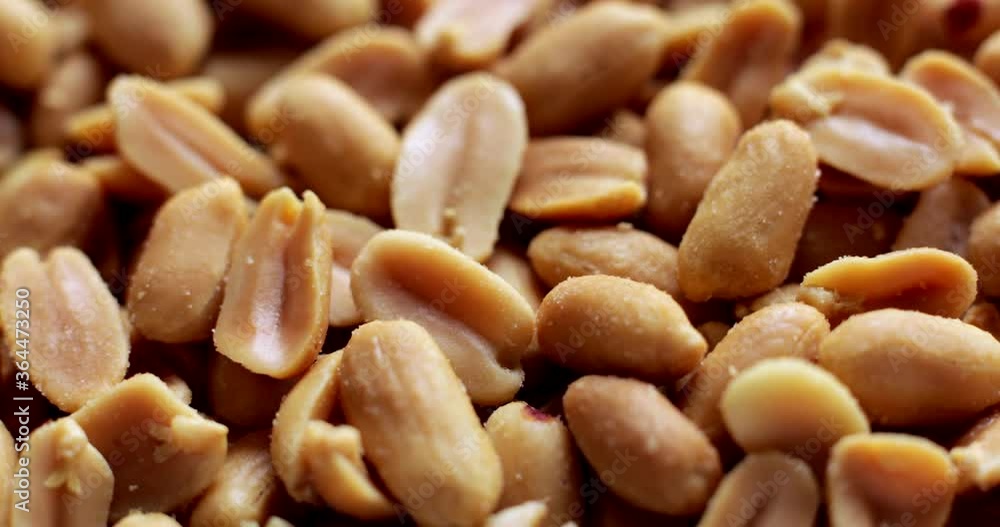 Full Frame Close Up Shot Of Salted Peanuts Rotating On Turntable Full Frame Close Up Shot Of Salted Peanuts Rotating On Turntable