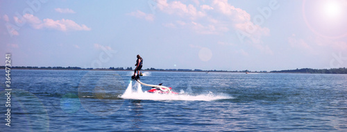 Water sport Flyboard on water during summer vacation photo