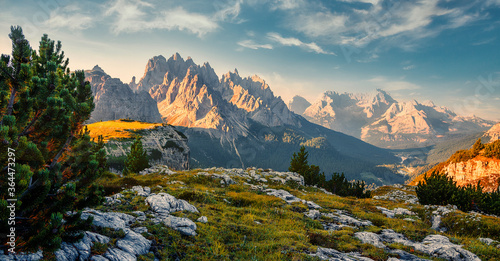 Scenic image at alps during sunrise. Incredible summer landscape. Panorama of Dolomiti, Tre Cime di Lavaredo. Drei Zinnen. The most beautiful attraction of Dolomites Alps. Italy. Awesome Nature.