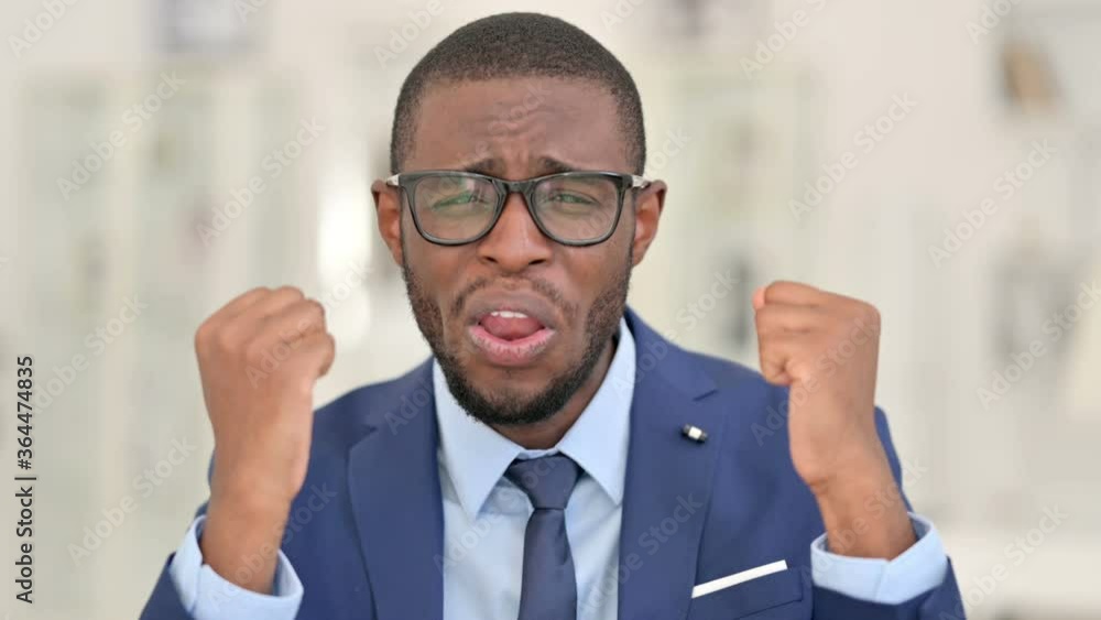 Portrait of Upset African Businessman reacting to Loss, Failure Portrait of Upset African Businessman reacting to Loss, Failure