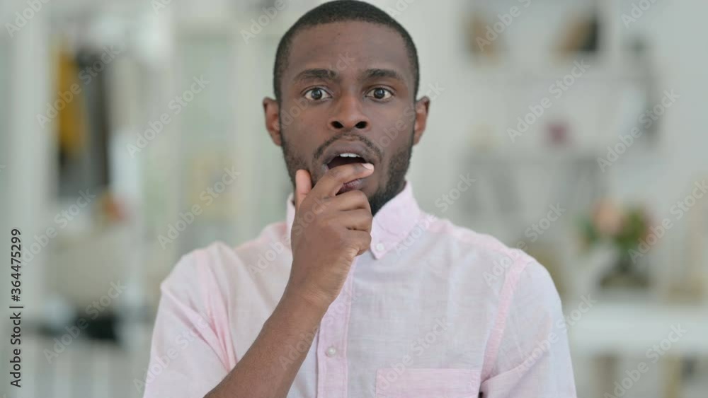 Portrait of Upset African Man Feeling Shocked Portrait of Upset African Man Feeling Shocked