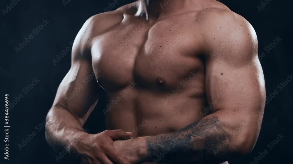 Fit and sporty bodybuilder over black background. Bodybuilder in studio. Sport and fitness. Fit and sporty bodybuilder over black background. Bodybuilder in studio. Sport and fitness.