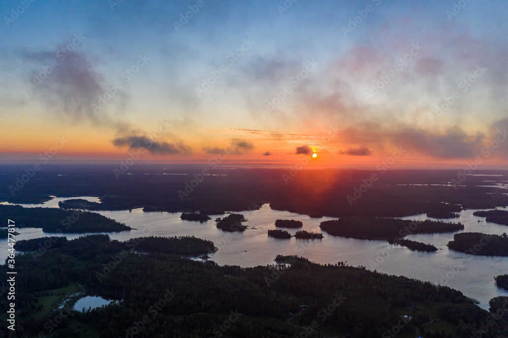 Sunrise over the islands of the water world in Karelia. Aerial view.