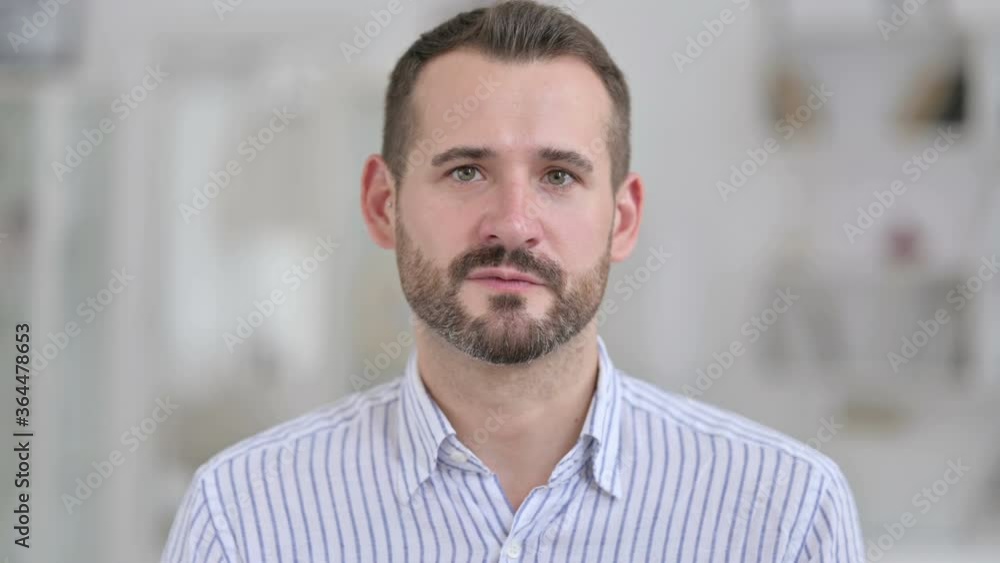 Portrait of Attractive Young Man Talking on Video Call Portrait of Attractive Young Man Talking on Video Call