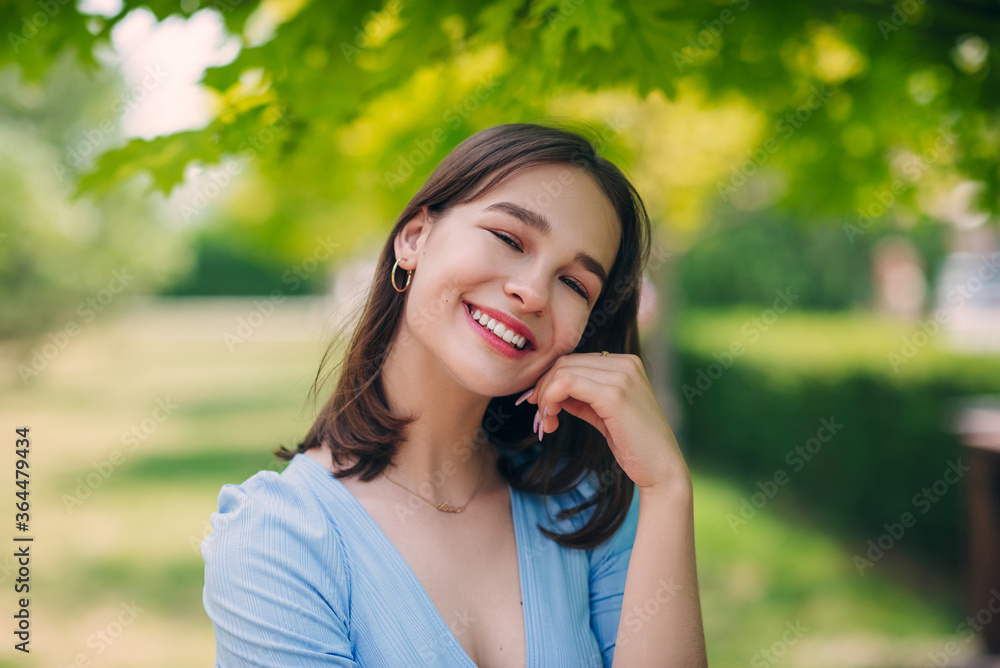 Beautiful girl is smiling. Sunny warm colors. Copyspace Beautiful girl is smiling. Sunny warm colors. Copyspace