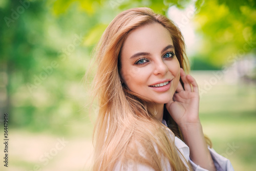 Beautiful girl is smiling. Sunny warm colors. Copyspace