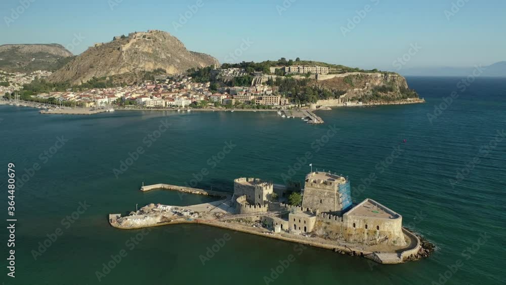 Aerial drone video of medieval Venetian small islet and fortress of Bourtzi built in bay of historic seaside town of Nafplio used as a prison in past times, Argolida, Peloponnese, Greece Aerial drone video of medieval Venetian small islet and fortress of Bourtzi built in bay of historic seaside town of Nafplio used as a prison in past times, Argolida, Peloponnese, Greece