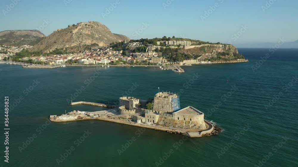 Aerial drone video of medieval Venetian small islet and fortress of Bourtzi built in bay of historic seaside town of Nafplio used as a prison in past times, Argolida, Peloponnese, Greece Aerial drone video of medieval Venetian small islet and fortress of Bourtzi built in bay of historic seaside town of Nafplio used as a prison in past times, Argolida, Peloponnese, Greece