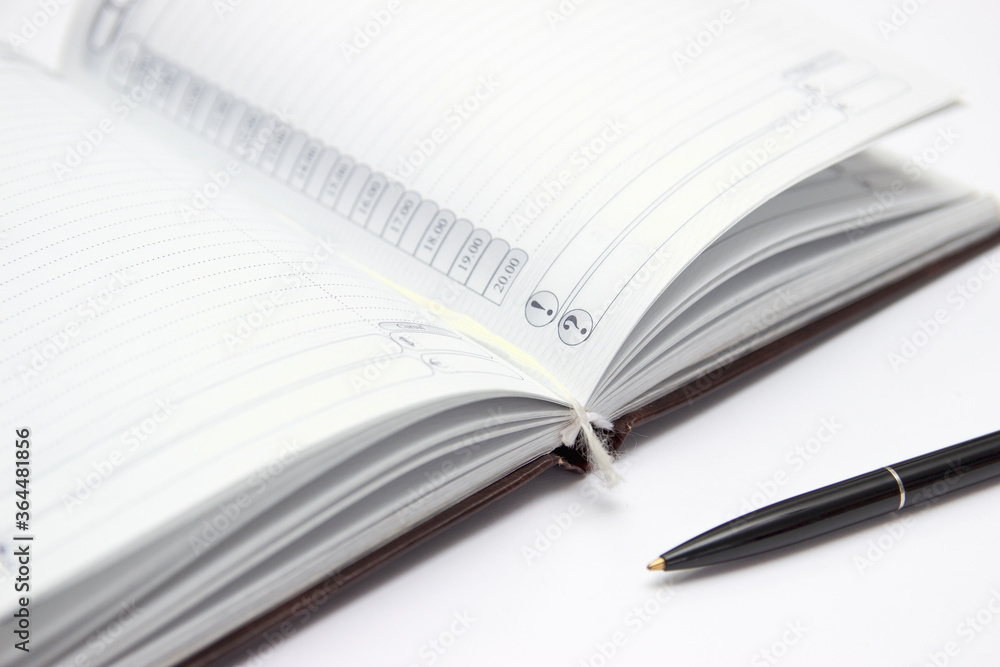 Open notebook with a pen, horizontal. Open notebook with a pen, horizontal.