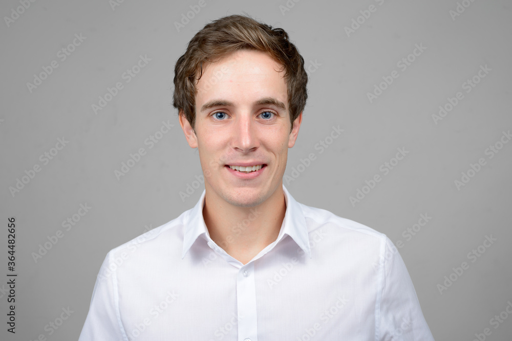 Face of happy young handsome businessman smiling Face of happy young handsome businessman smiling