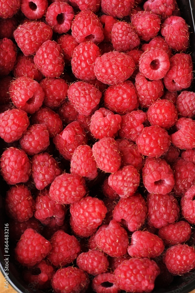 Delicious ripe raspberries on the market macro Delicious ripe raspberries on the market macro