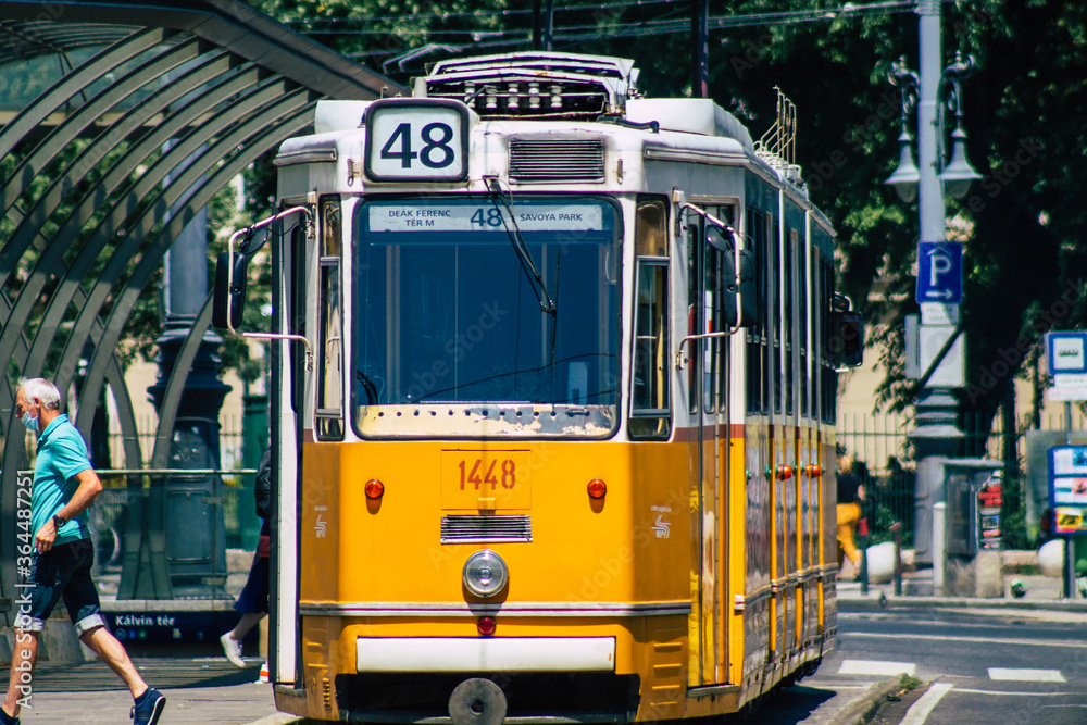  View of a traditional Hungarian electric tram for passengers driving through the streets and part of the public transport system of Budapest, the capital of Hungary