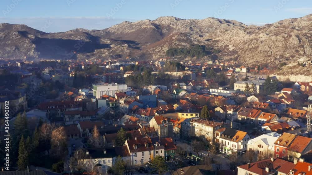 Cetinje, the old royal capital of Montenegro, surrounded by mountains, on a sunny afternoon. Aerial footage. Cetinje, the old royal capital of Montenegro, surrounded by mountains, on a sunny afternoon. Aerial footage.