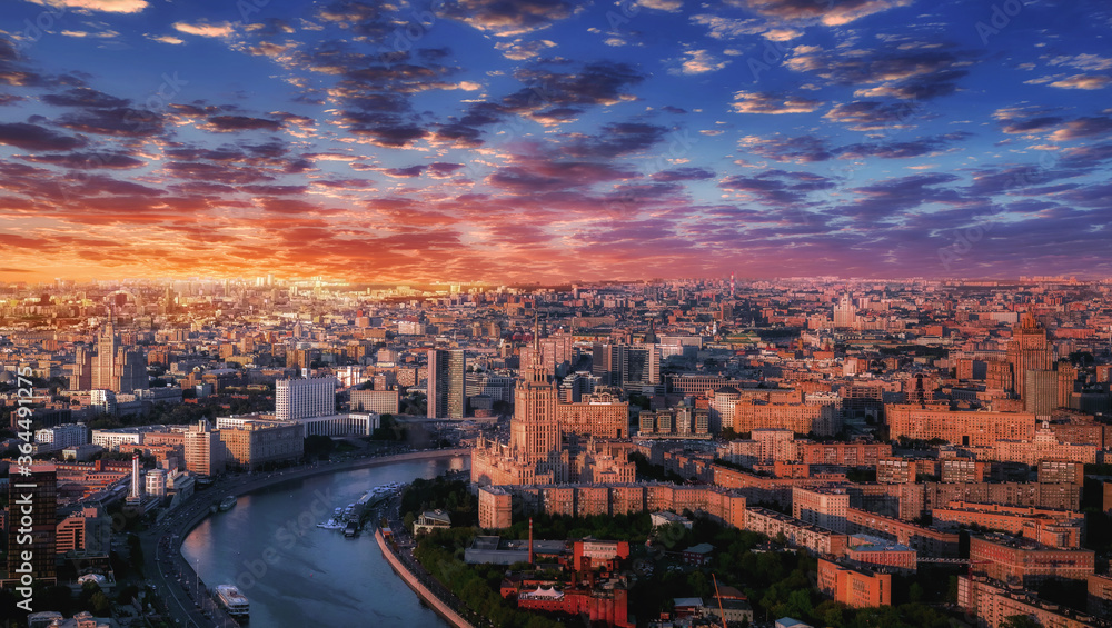 Moscow aerial sunset panorama with river and buildings under dramatic sky