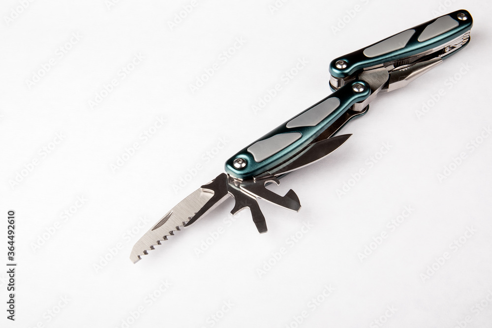 Multitool with green and grey handles on white background. Tools for cutting, sawing, screwing, compressing, bottle opening and other purposes Multitool with green and grey handles on white background. Tools for cutting, sawing, screwing, compressing, bottle opening and other purposes