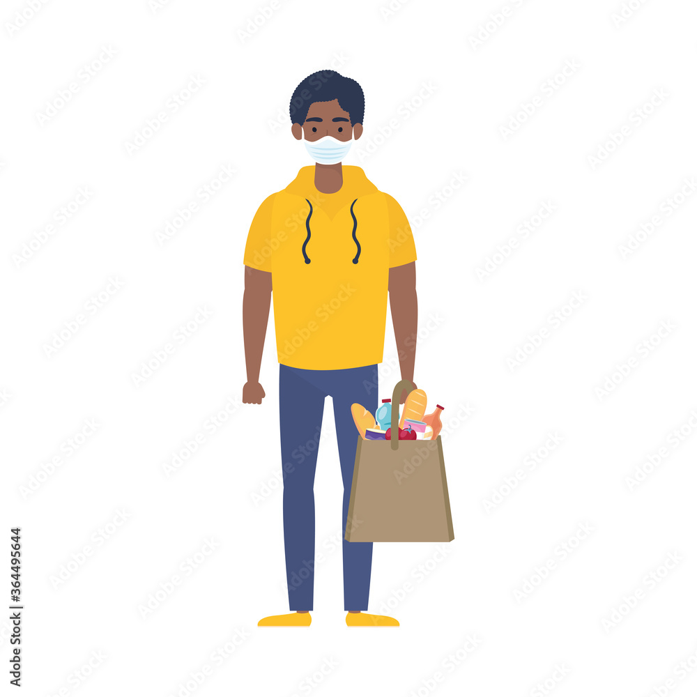 afro man using medical mask with supermarket bag afro man using medical mask with supermarket bag