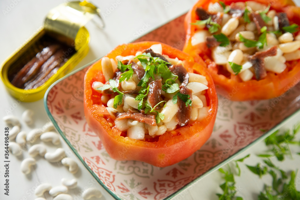 Stuffed premium tomato with beans, egg, and anchovies. Stuffed premium tomato with beans, egg, and anchovies.