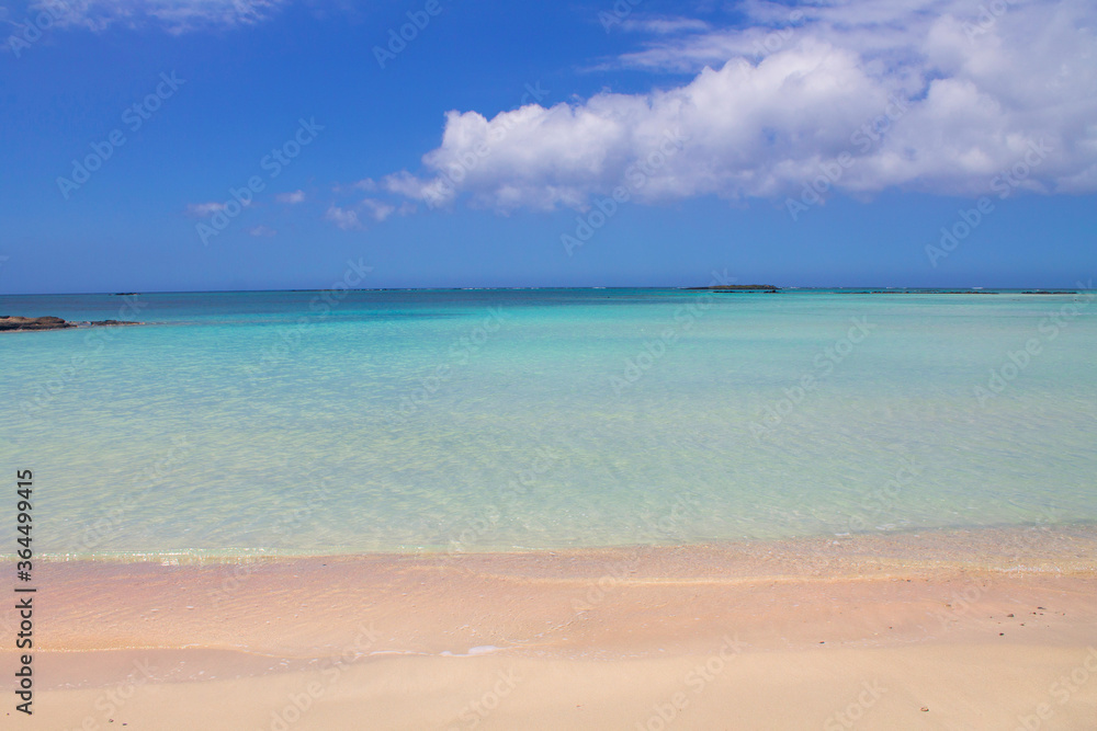 Beach with pink sand and turquoise water and clouds in blue sky. Beach with pink sand and turquoise water and clouds in blue sky.