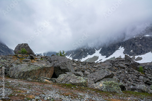 View of the area near The Lake Blavatnet, rocks, mountain and clouds, Lyngen Alps, Norway © hivaka