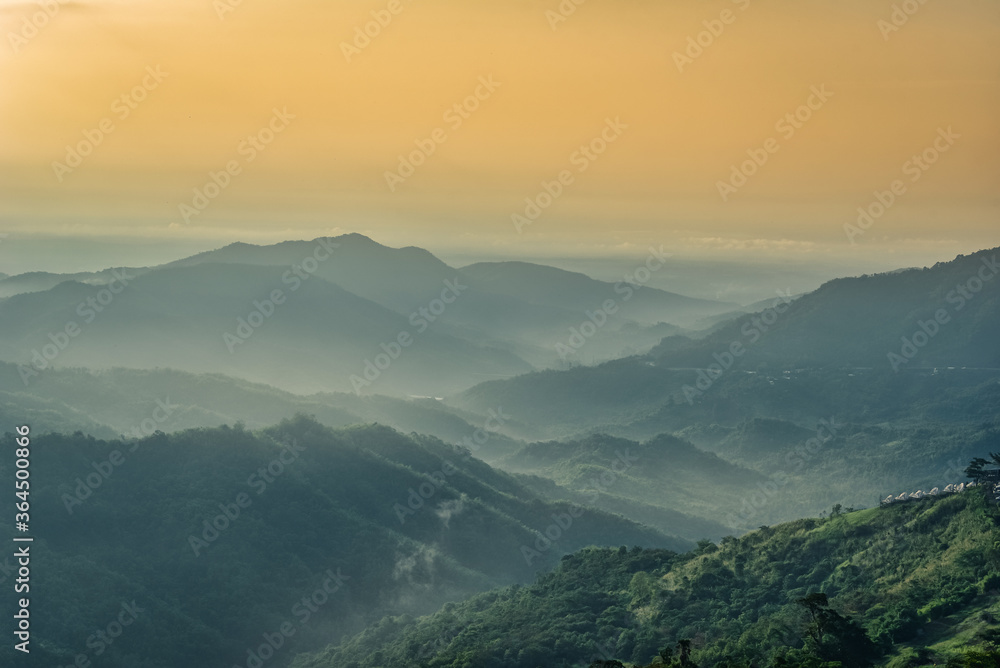Foggy in the mountains with dramatic sky at sunrise Foggy in the mountains with dramatic sky at sunrise