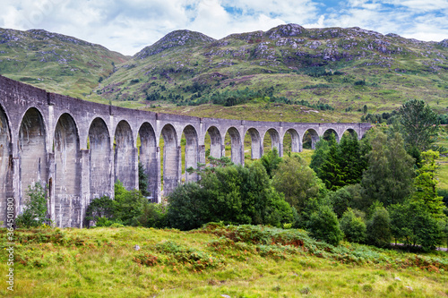 The Glenfinnan viaduct during summertime on the westcoast of Scotland, United Kingdom photo