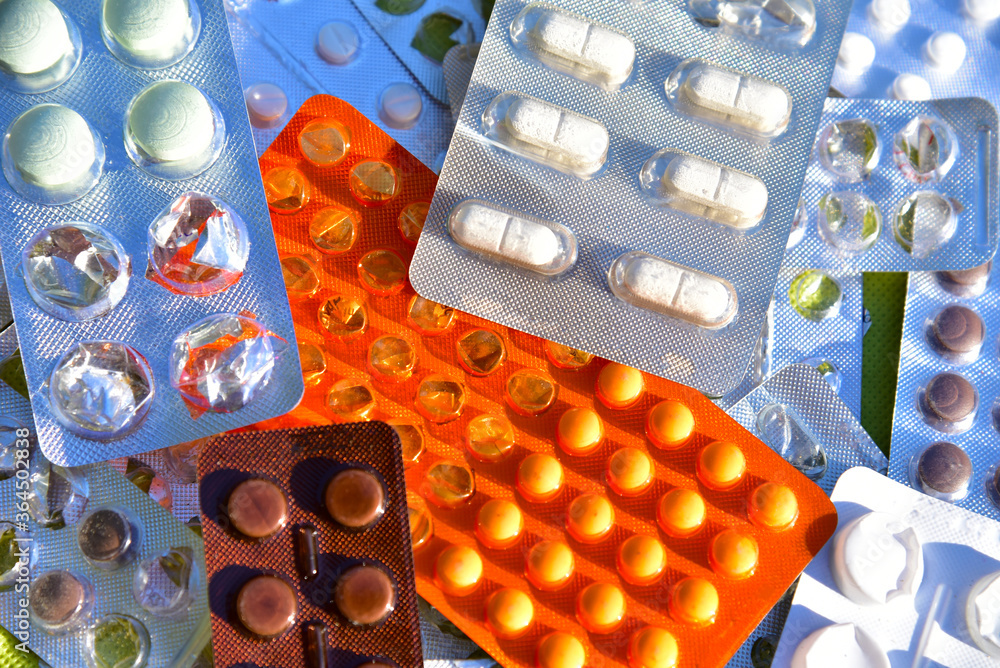 many-colorful-tablets-and-medicines-drugs-in-plastic-pharmaceutical