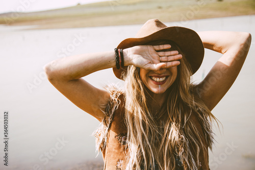 close up of a boho blonde girl outdoors in a sunny day