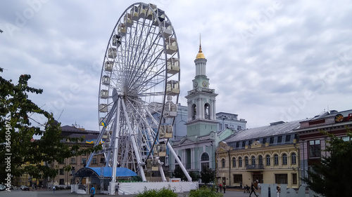 Kiev, Ukraine -July 10, 2020. Ferris wheel on the old Kontraktova square in Kiev near the Greek monastery. 