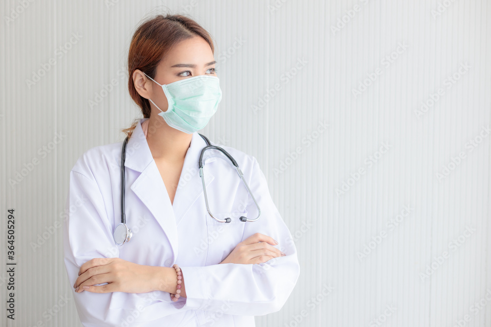 Asian female doctor wearing a mask and stethoscope Asian female doctor wearing a mask and stethoscope