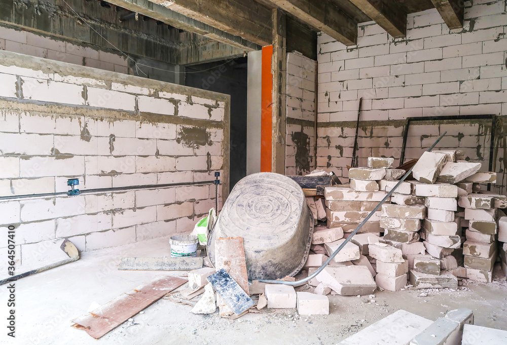 House under the construction site wall made from aerated bricks or ...