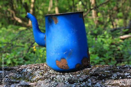 old lost blue ketle in forest photo