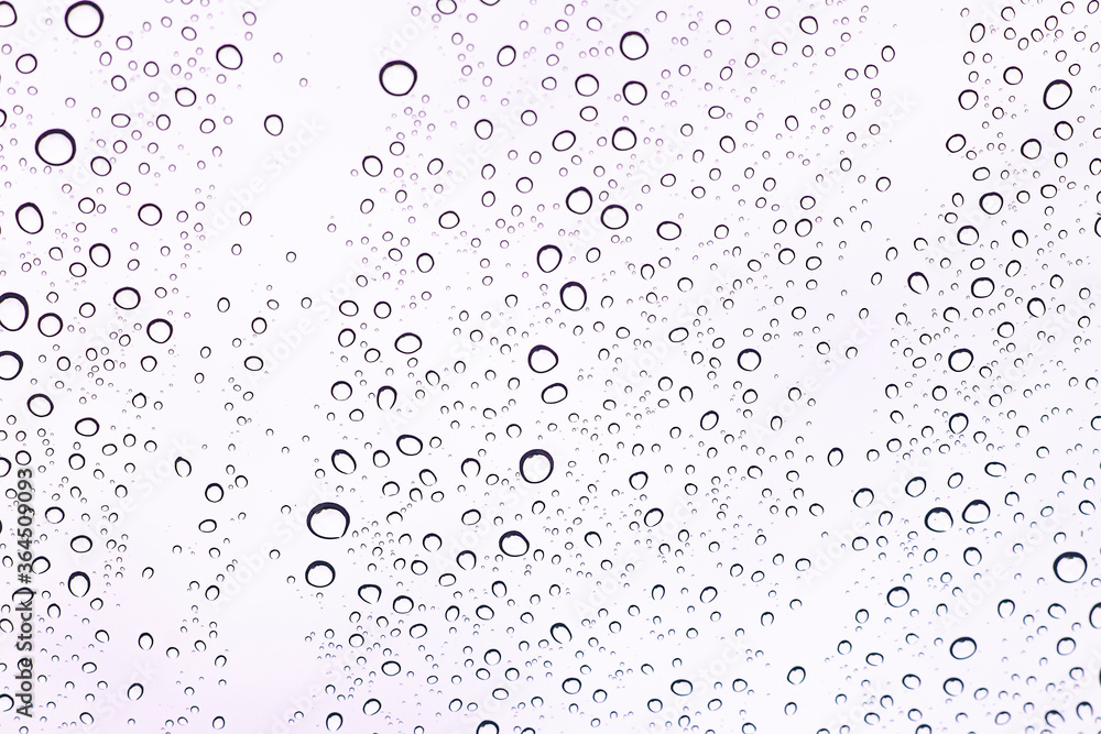Water droplets adhering to the windshield of the car. Water droplets adhering to the windshield of the car.