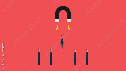 super businessman choosing by magnet .Symbol of stealing , abducted ,choosing, leadership,Successful vision and idea concept