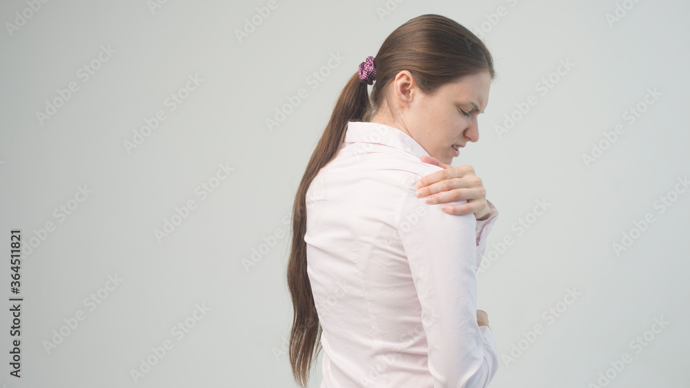 Tired woman feeling pain, massaging tense muscles Tired woman feeling pain, massaging tense muscles