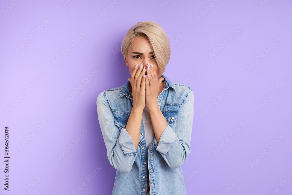 portrait of caucasian woman closing her mouth with fingers. worried gesture, can't say anything. shocked surprised to hear bad news or gossip portrait of caucasian woman closing her mouth with fingers. worried gesture, can't say anything. shocked surprised to hear bad news or gossip