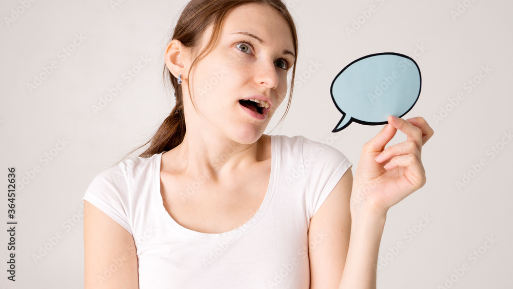 woman holding blank speech bubble on white background woman holding blank speech bubble on white background