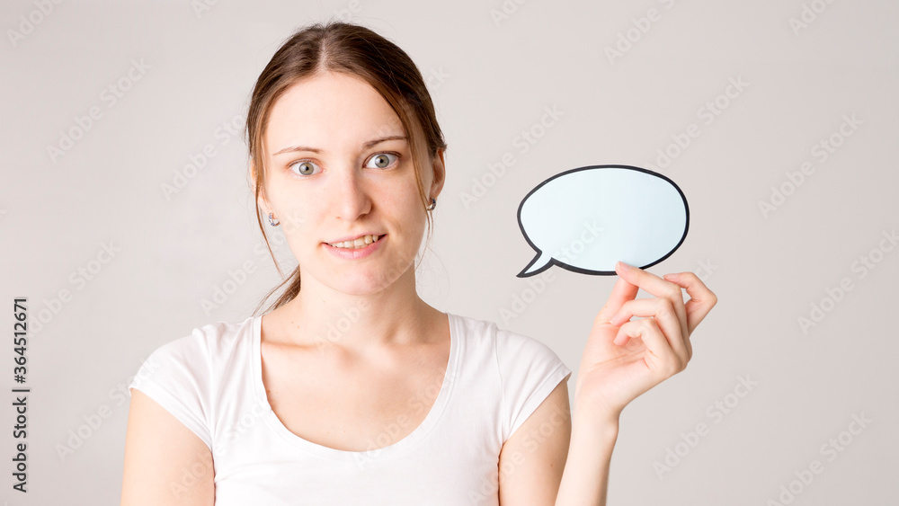 woman holding blank speech bubble on white background woman holding blank speech bubble on white background