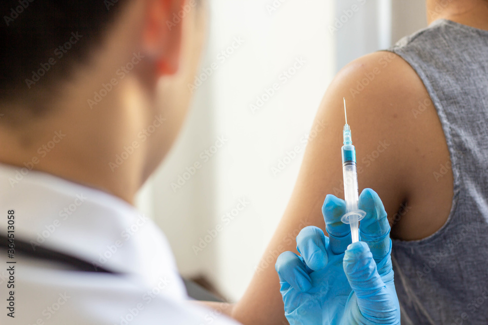 The doctor prepared a syringe to inject the patient with the underlying symptoms in the hospital. The doctor prepared a syringe to inject the patient with the underlying symptoms in the hospital.