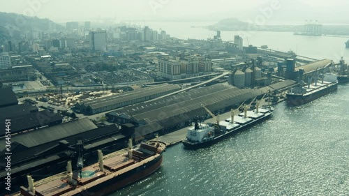 Port of Santos, Brazil, aerial view of the movement of cargo vessels and cranes for export.
