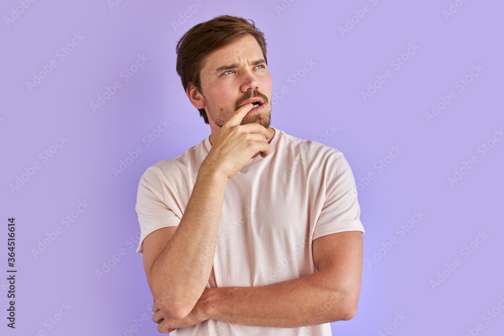 thoughtful caucasian bearded guy isolated in studio, young man is worried about something thoughtful caucasian bearded guy isolated in studio, young man is worried about something